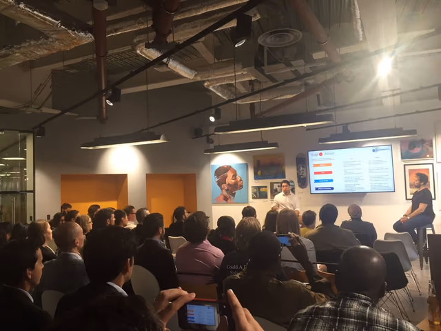 Emin speaking to an audience at a London event